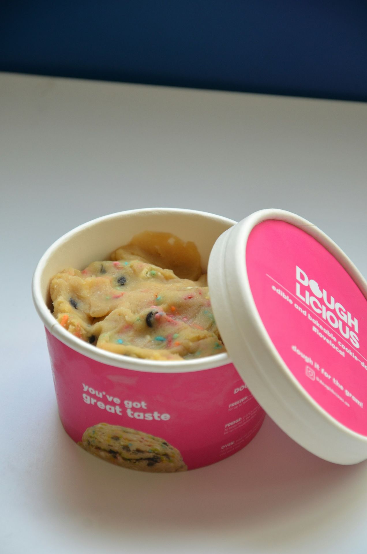 a cup of ice cream with a cookie in it